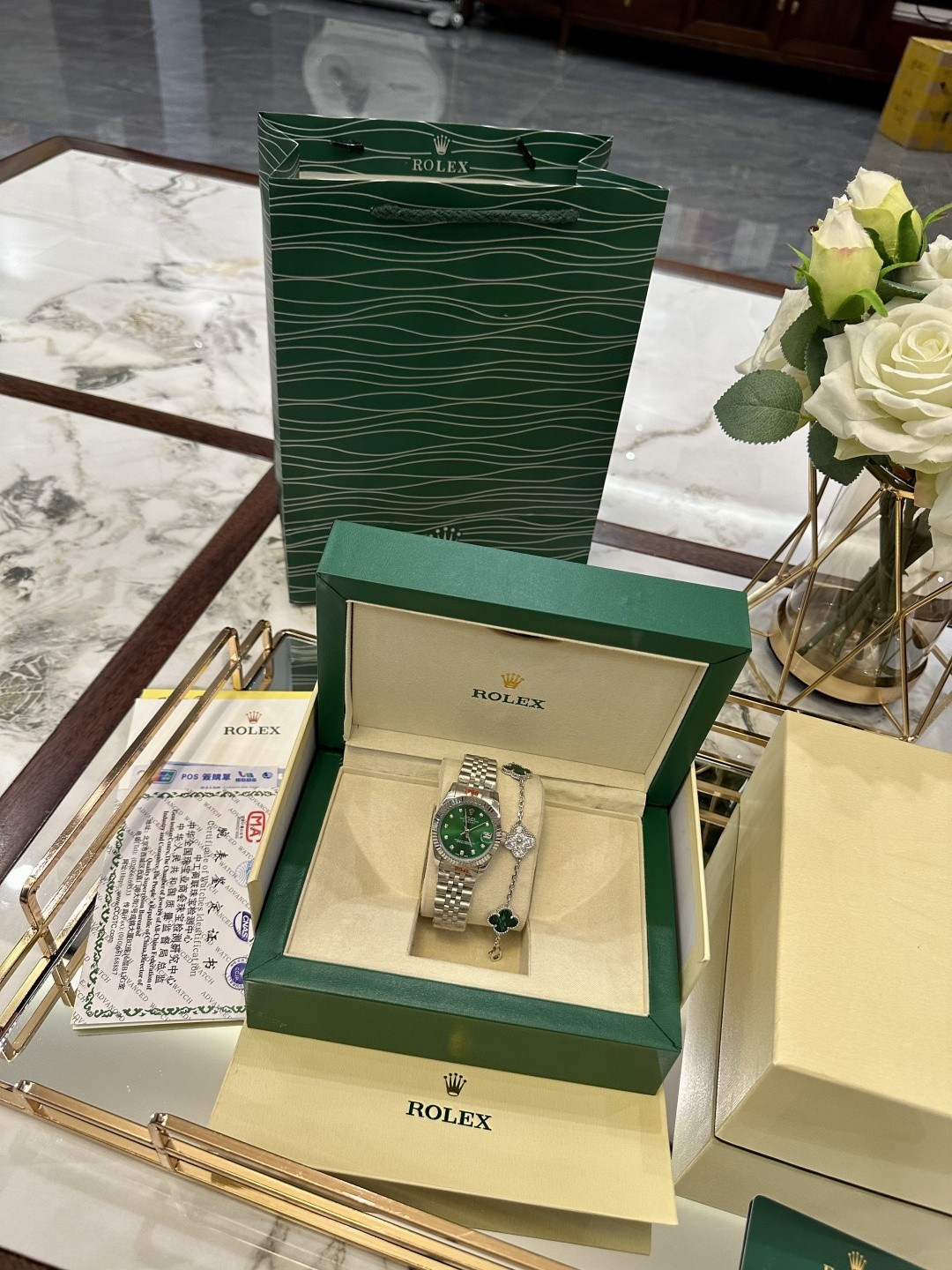 The Rolex watch is a Datejust model.