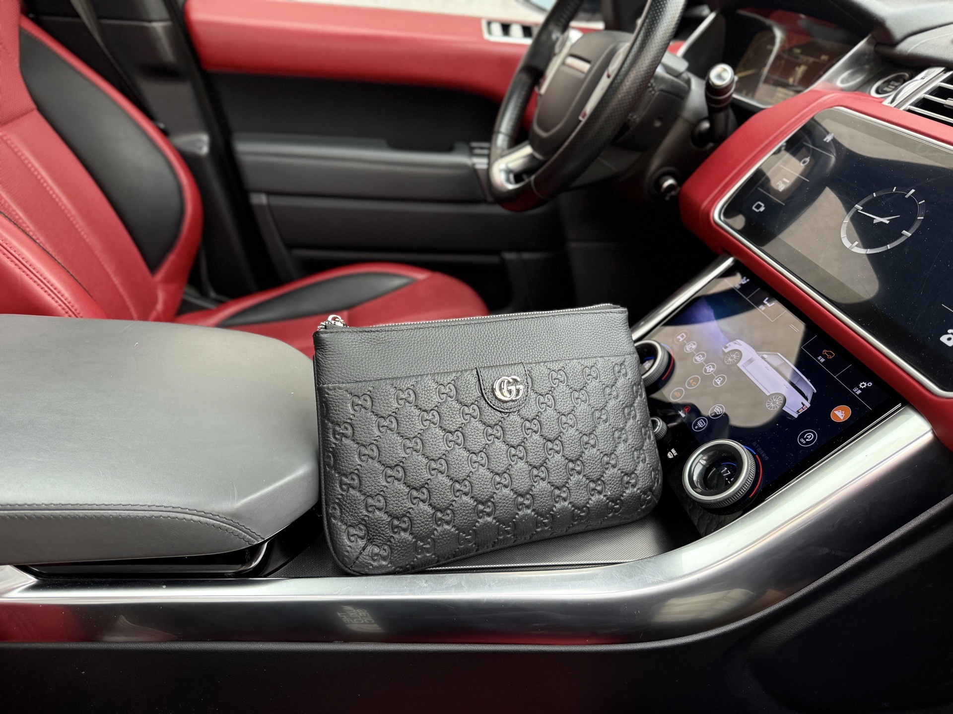 Gucci GG Embossed Leather Clutch