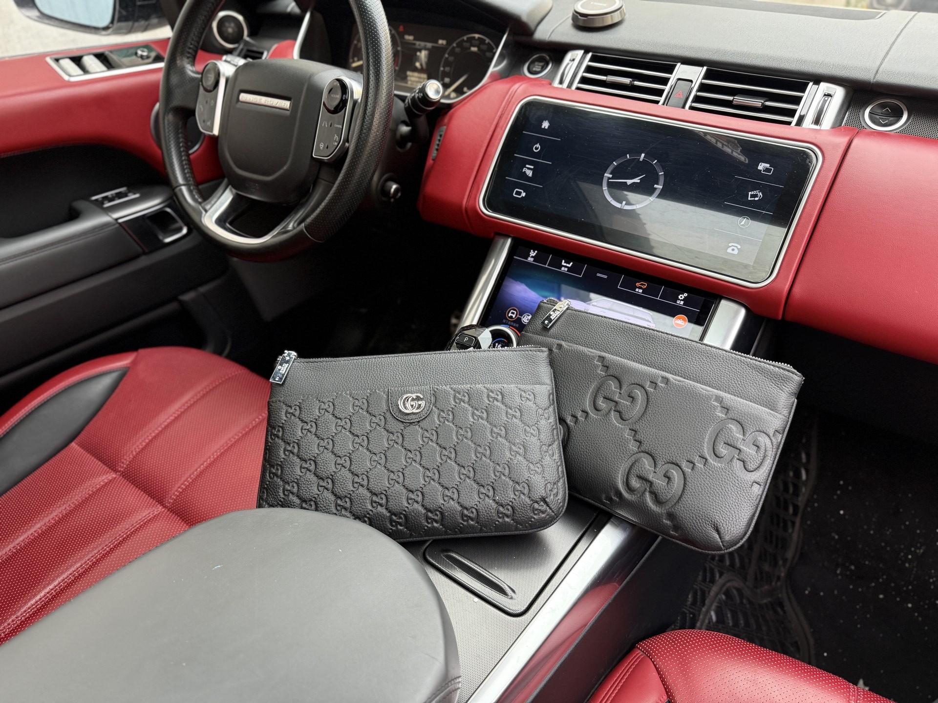 Gucci GG Embossed Leather Clutch