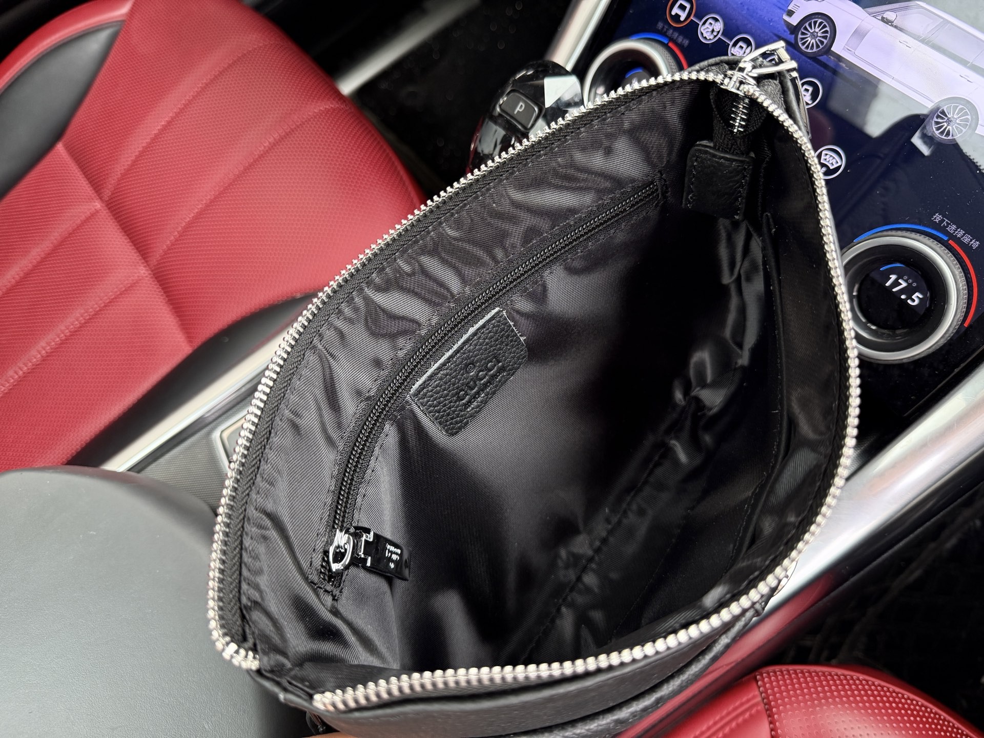 Gucci GG Embossed Leather Clutch