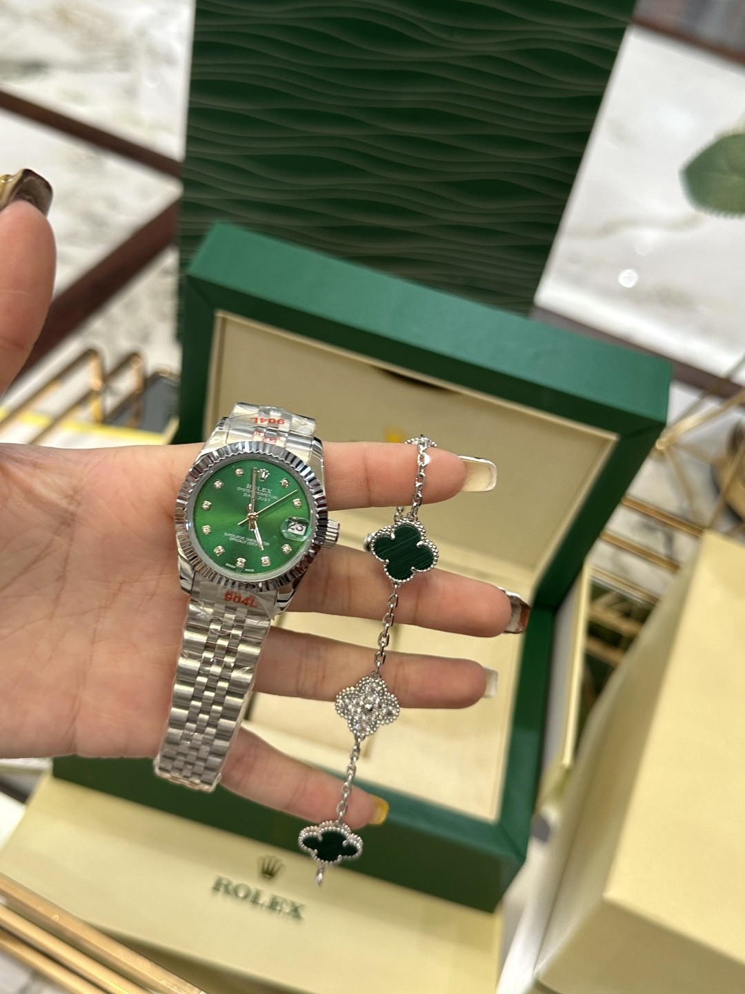 The Rolex watch is a Datejust model.