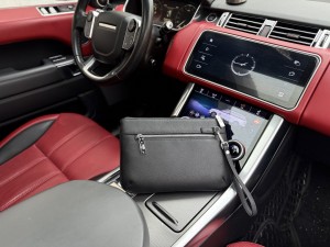 Gucci GG Embossed Leather Clutch