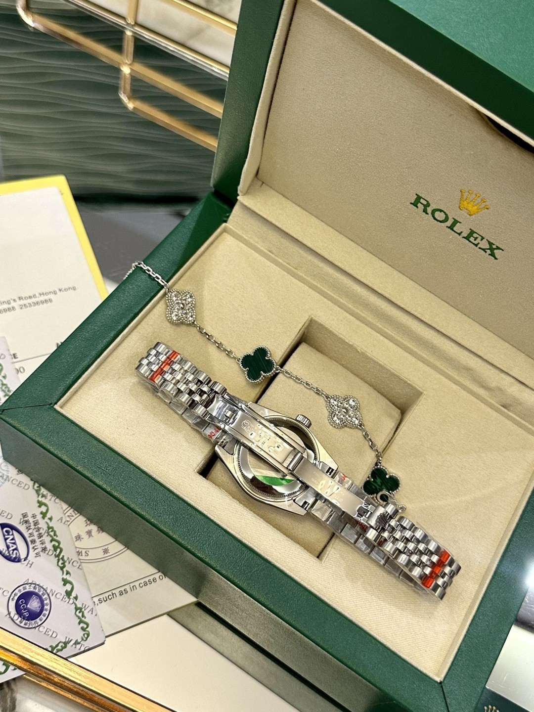The Rolex watch is a Datejust model.