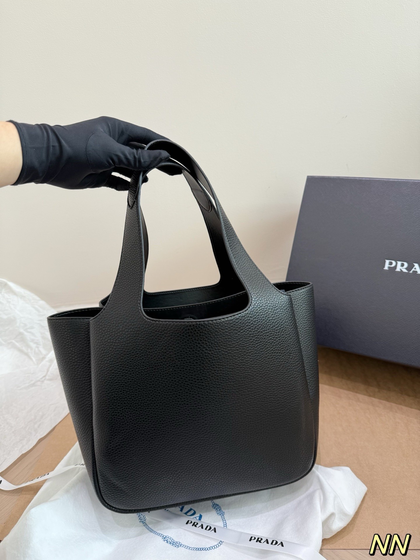 (Prada) black leather handbag