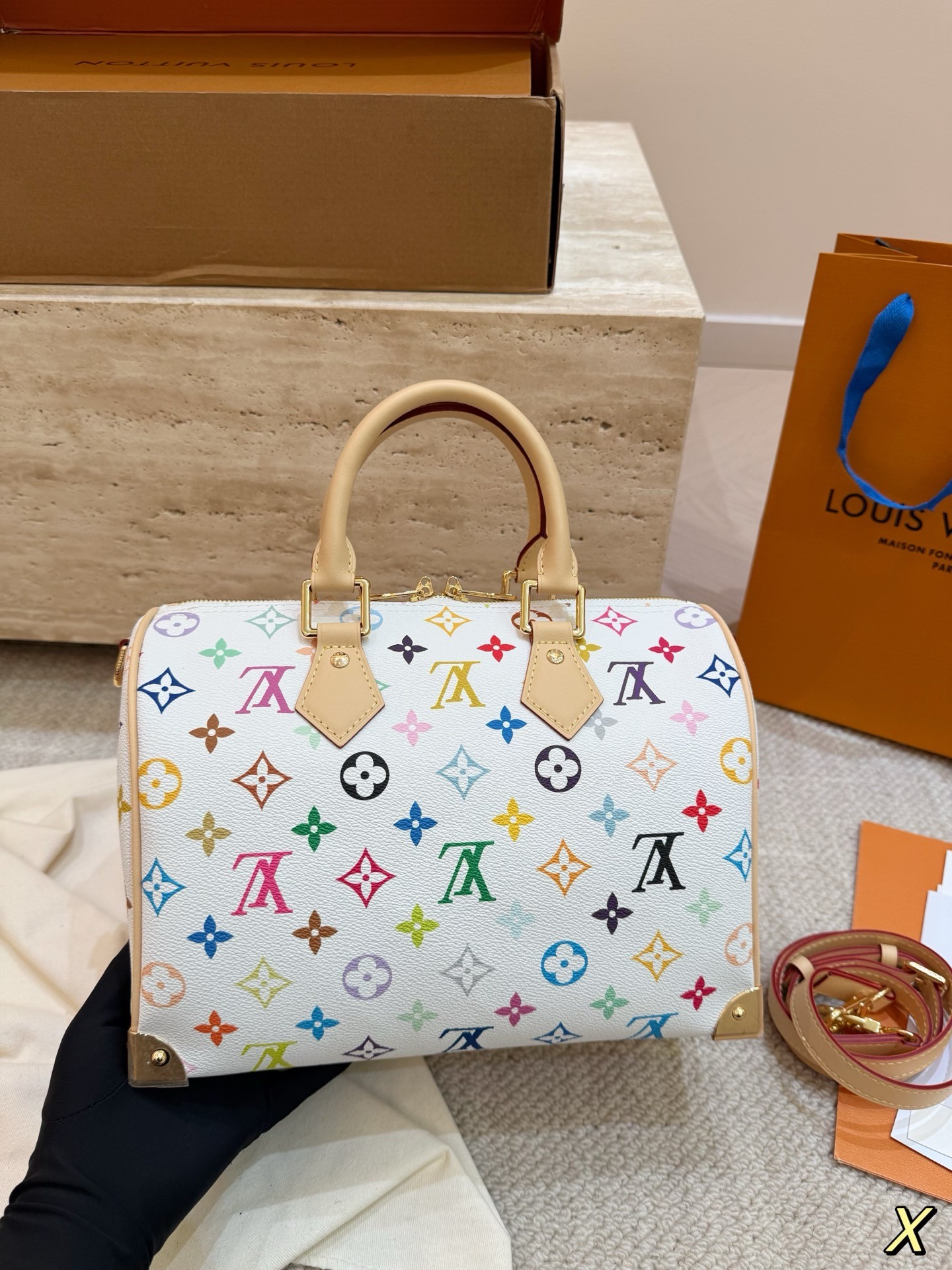 The limited-edition Speedy Bandoulière 25 from Louis Vuitton's collaboration with Japanese artist Takashi Murakami.
