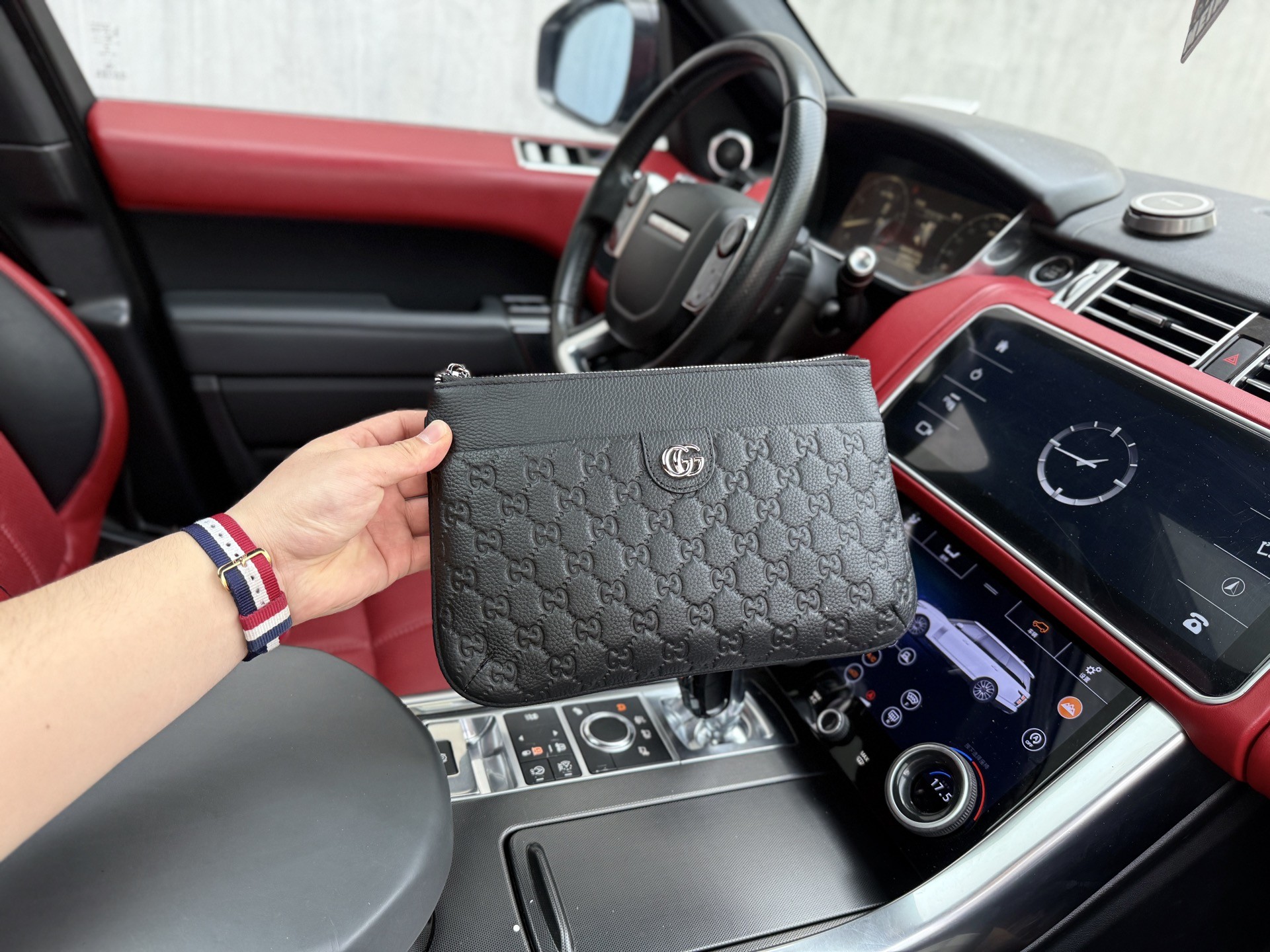 Gucci GG Embossed Leather Clutch